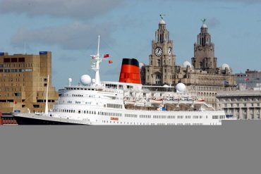 Cruise liner on the River Mersey with the Liver Buildings in the background