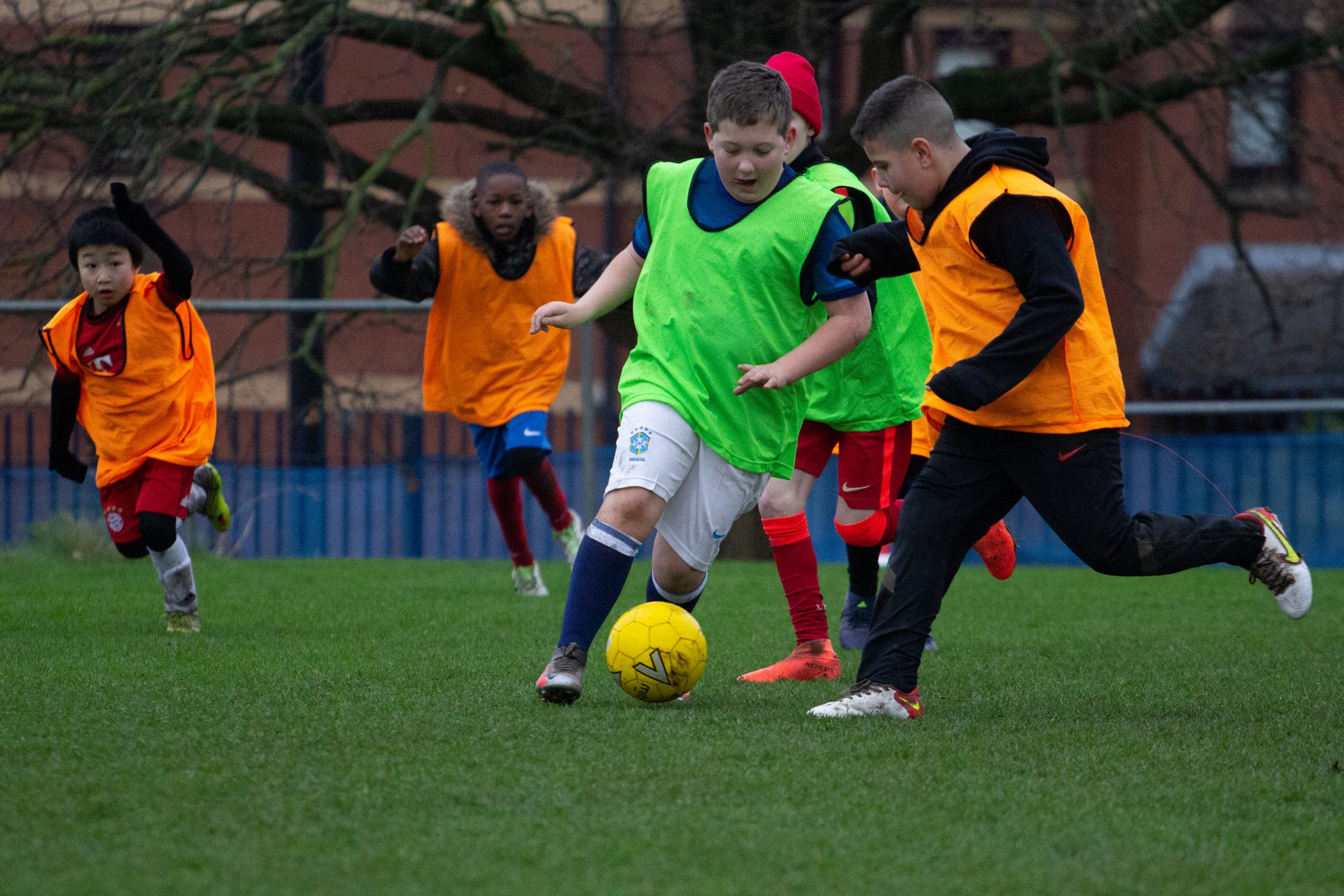 Young people playing football