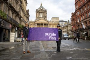 Cllr Abdul Qadir and Inspector Charlotte Irlam with Liverpool's Purple Flag