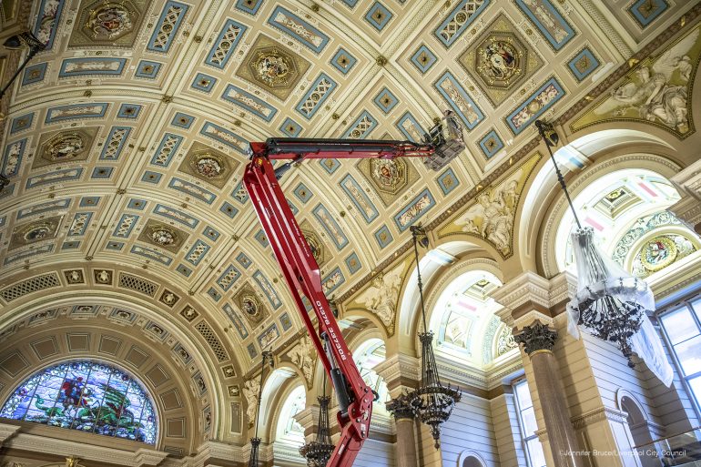 A cherry picker enables work to be carreid out on the Great Hall ceiling
