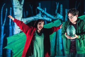 A male and female acting on a stage as part of 'Another Dragons Roar' performance