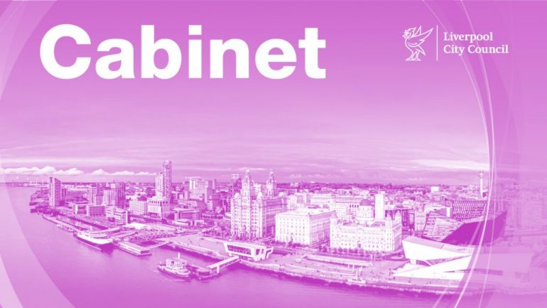 Purple washed Liverpool waterfront with the word 'Cabinet' above it