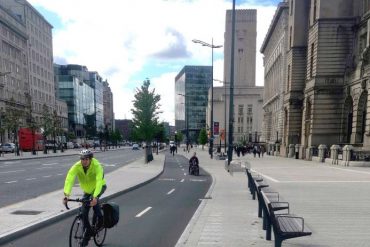 Cyclist riding on a cycle lane in Liverpool