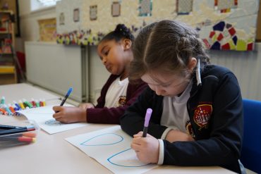 Children drawing in a classroom