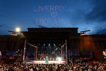 Image of Big Eurovision Welcome event features stage in front of St George's Hall witht he words Liverpool and Ukraine in the sky. Photo courtesy of Getty Images