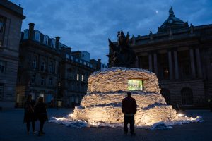 Nelson Monument in Exchange Flags covered in sandbags as part of a EuroFestival commission called Protect the Beats