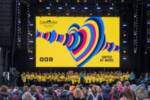 The 100 Voices choir performing on the Eurovision Village stage in May 2023
