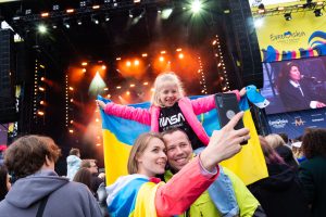 Image of a family taking a selfie at Liverpool's Eurovision Village