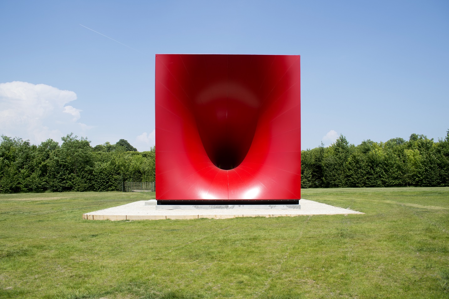Anisha Kapoor Red box artwork in a green space