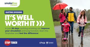 "A family walking outdoors in rainy weather, with two children on scooters and the parents holding an umbrella. The image features a green banner with the text 'Smoke Free Liverpool,' 'Quitting Smoking - It's Well Worth It,' and 'In just 28 days, quitting smoking can improve your circulation and lung function. Start this Stoptober and feel the difference!' Logos for Stoptober, CHCP, and Liverpool City Council are displayed at the bottom."