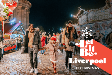 three people walking at Liverpool Christmas Market