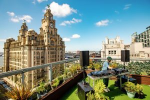View of a DJ and the Liver Building