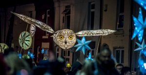 An owl-shaped lantern in the night sky