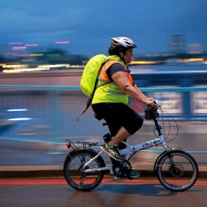 A person cycling in the dark.