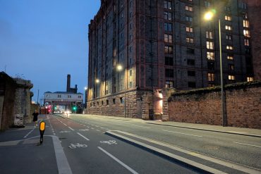 A road in the evening, with streetlights turned on