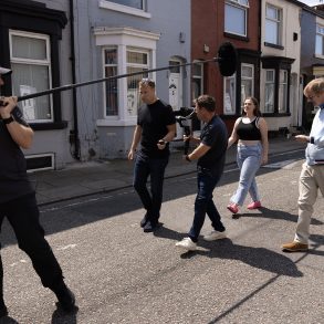 Camera crew filming on the street