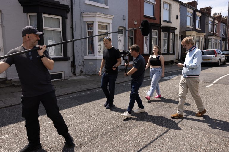 Camera crew filming on the street