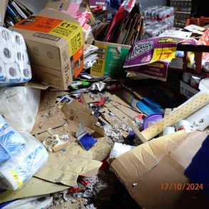 Boxes and household goods piles up with mouse droppings among them.