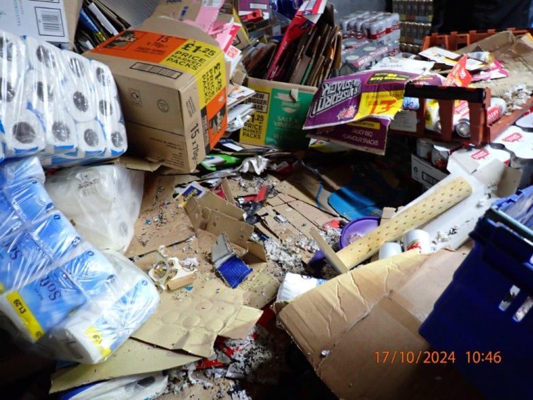 Boxes and household goods piles up with mouse droppings among them.