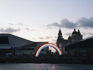 Liver building with a rainbow in front.