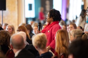Woman standing in a crowded room