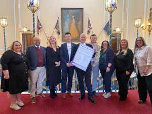 Cabinet Members stood in a line holding the SmokeFree pledge board.