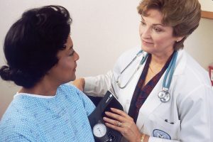 A nurse looking after a patient