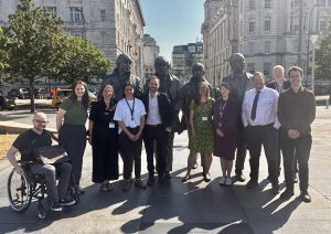 HDRC and NIHR team in front of the Beatles statues.