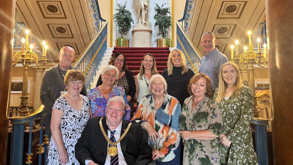 A group of people at the bottom of the stairs at Liverpool Town Hall