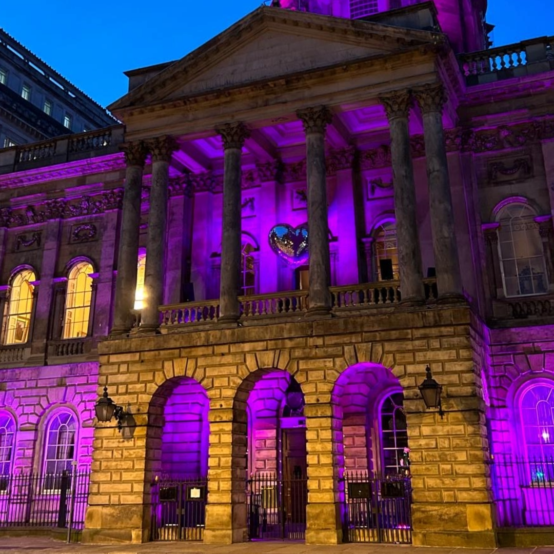 Liverpool Town Hall lit up purple