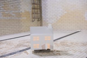 A paper house sat in a room